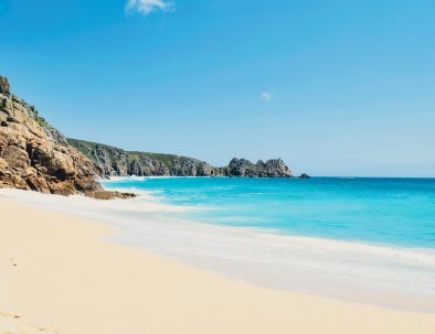 Gorgeous Porthcurno beach in sunshine with golden sand